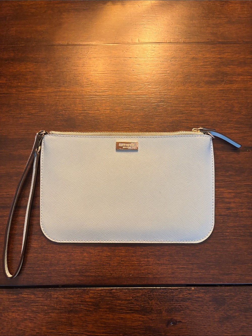 kate spade pale blue wristlet clutch with gold-tone logo